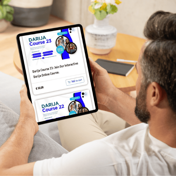 "A man using a tablet to learn Darija on the EasyProgressMaroc platform."